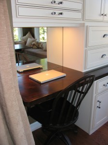 I used mirrors as a backsplash at each workstation as well as behind the TV to reflect light, nature, and the beautiful fabrics in the room.