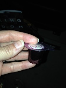 Communion cup we grabbed on our way into the sanctuary. Pull back the first tab to expose the cracker (the body). Pull back the second tab to drink the juice (the blood that was shed)